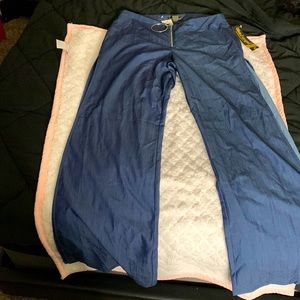 Blue denim bell bottom jeans slit on side of legs .. Stretchy